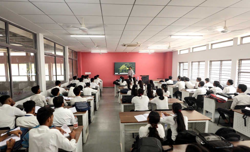 B.Com Professional students attending classroom lecture in commerce department