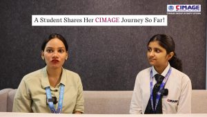 Interviewer and female student in college uniform during a discussion session at CIMAGE.